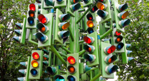 Stoplights in all directions with all the lights on
