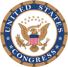 Seal of the United States Congress. Round insignia with gold border, internal royal blue circle with the words in white United States Congress and an American Eagle icon in the middle with gold stars above.