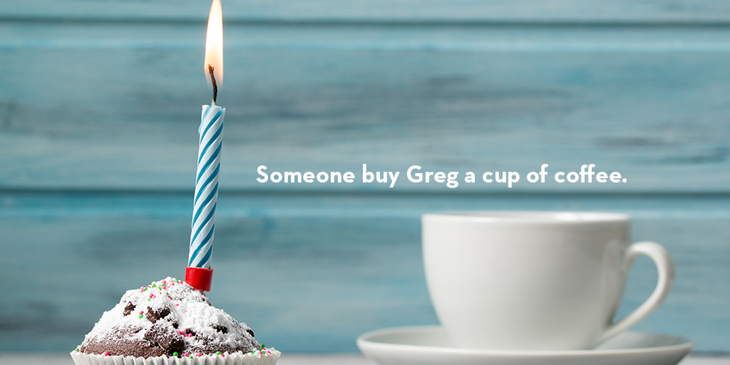 Birthday cupcake on the left with a burning candle, and to the right is a cup of coffee in a white mug, all set against a baby blue background. In white text above the cup is Someone Buy Greg a Cup of Coffee.